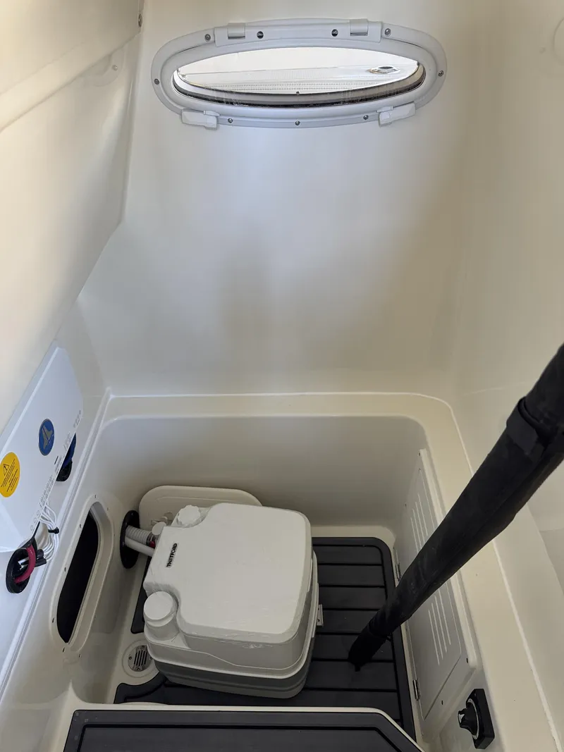 Slide: The Image of Interior of 2026 Pathfinder 2400 TRS with window and toilet. - 18