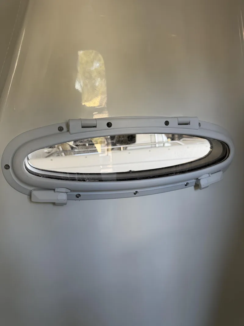 Slide: The Image of Oval window in Pathfinder 2400 TRS boat, year 2026. - 19