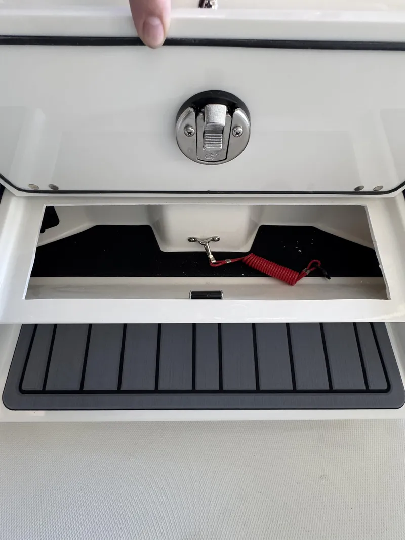 Slide: The Image of Pathfinder 2400 TRS 2026 storage compartment with red safety cord. - 28