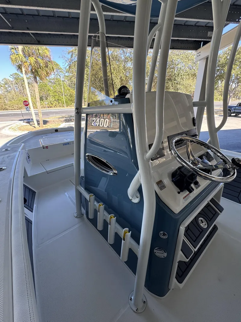 Slide: The Image of Pathfinder 2400 TRS 2026 boat console with steering and rod holders. - 35