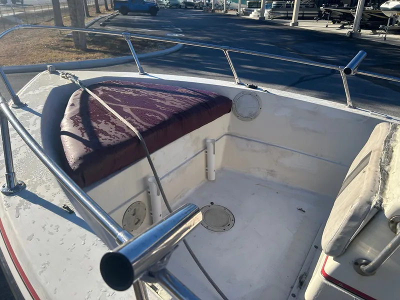 Slide: The Image of 1989 Pro-Line 16 boat with worn seat cushion. - 5