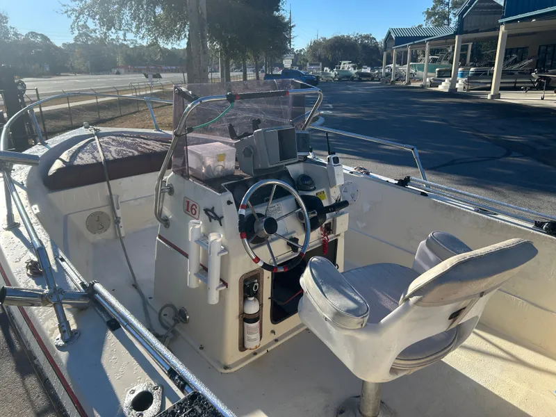 Slide: The Image of Interior view of a 1989 Pro-Line 16 boat with steering console. - 7