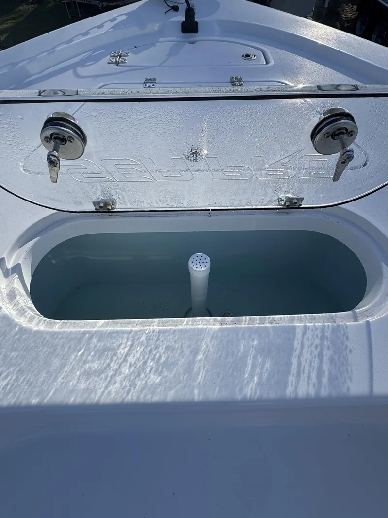 Slide: The Image of Sea Pro Bay 250 2025 with open storage compartment. - 10