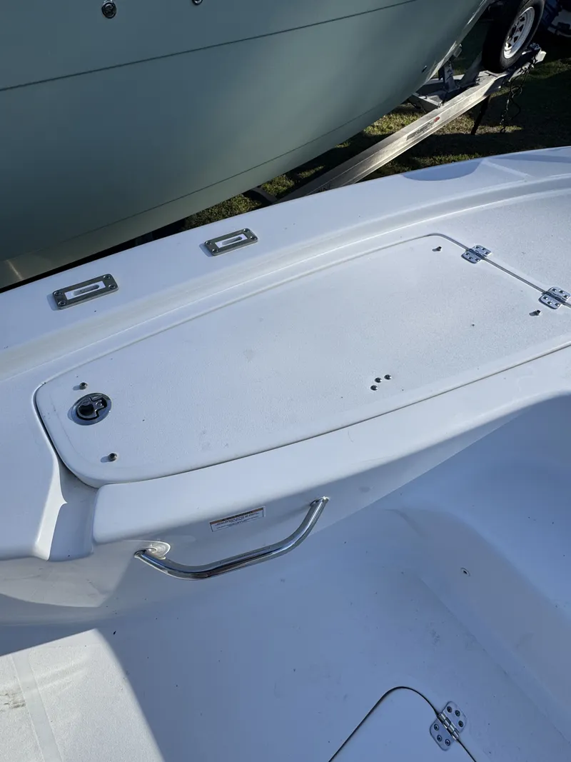 Slide: The Image of 2025 Sea Pro Bay 250 boat deck with storage compartment. - 12