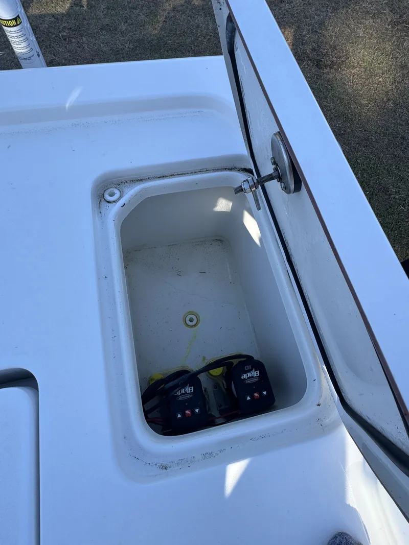 Slide: The Image of Open storage compartment on a 2025 Sea Pro Bay 250 boat. - 26