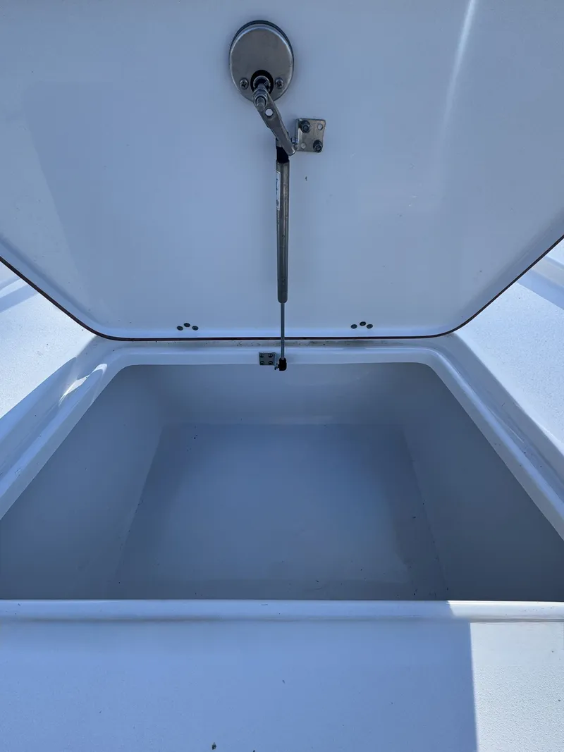 Slide: The Image of Open storage compartment in Sea Pro Bay 250 boat, year 2025. - 36