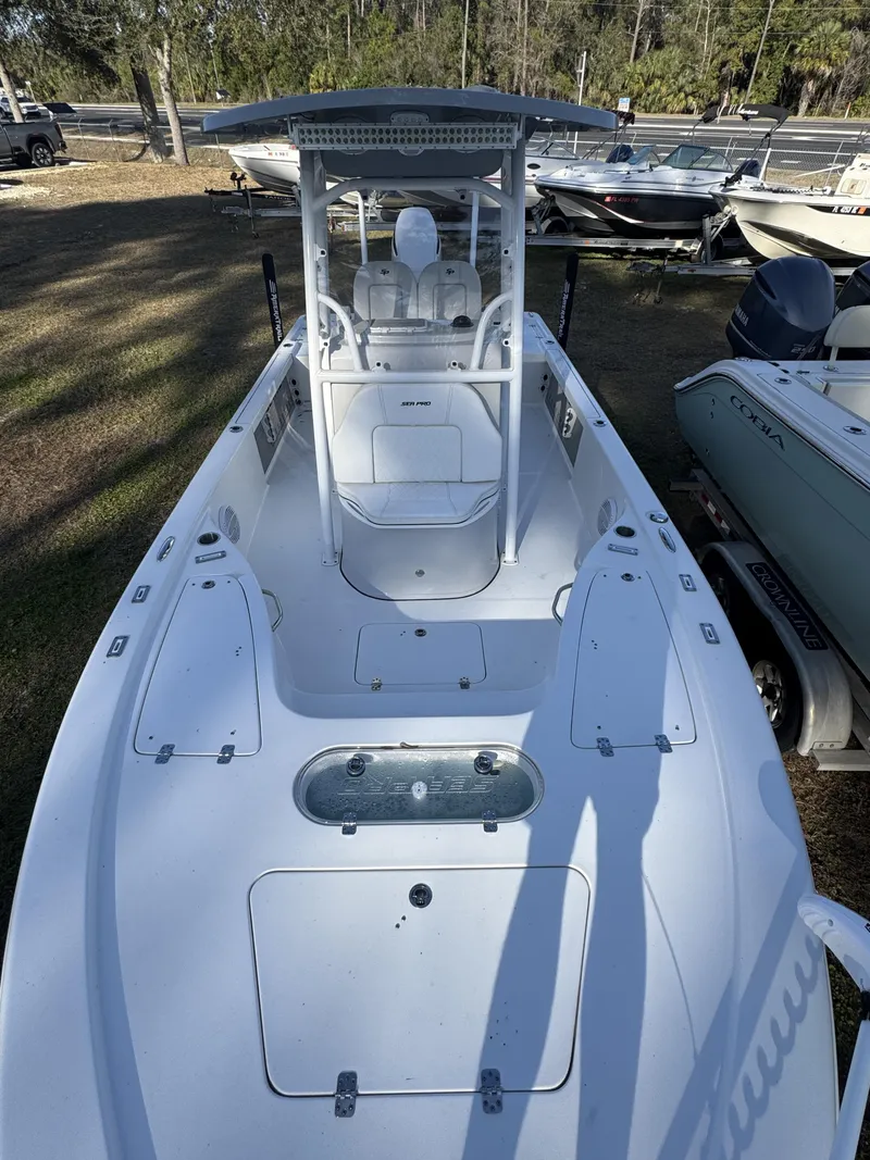 Slide: The Image of 2025 Sea Pro Bay 250 boat on a parking lot. - 8