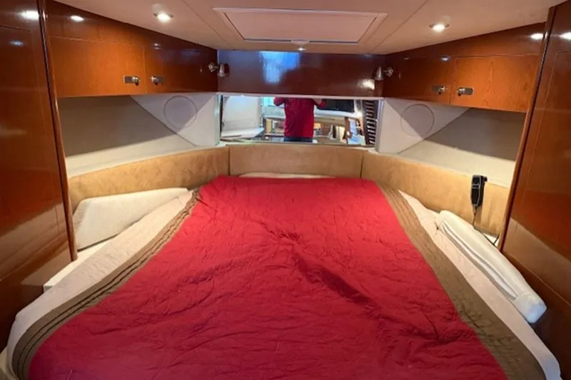 Slide: The Image of Luxurious cabin interior of 2011 Sea Ray Sundancer 370 with red bedding. - 15