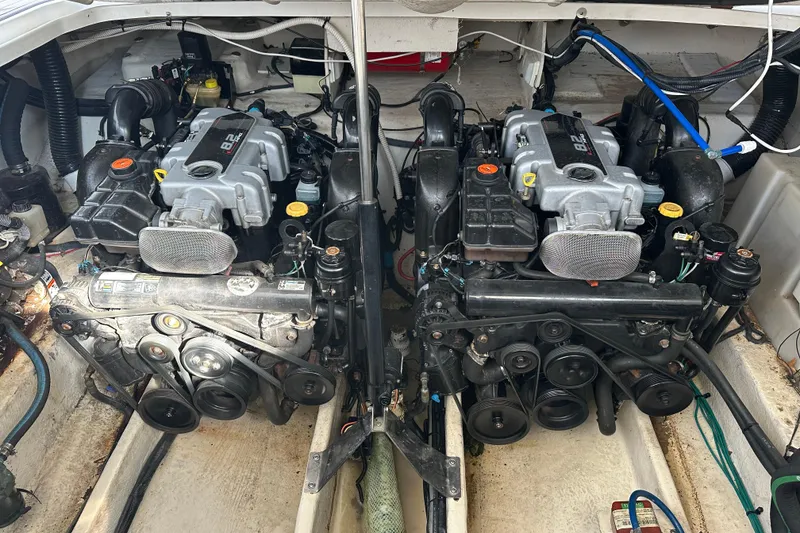 Slide: The Image of Twin engines in a 2011 Sea Ray Sundancer 370 boat engine compartment. - 28