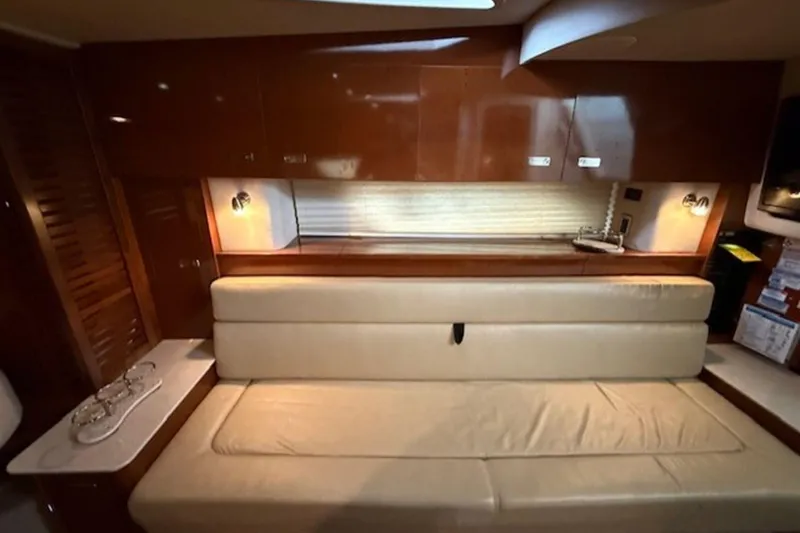 Slide: The Image of Luxurious interior of 2011 Sea Ray Sundancer 370 yacht with beige seating and wooden cabinetry. - 9