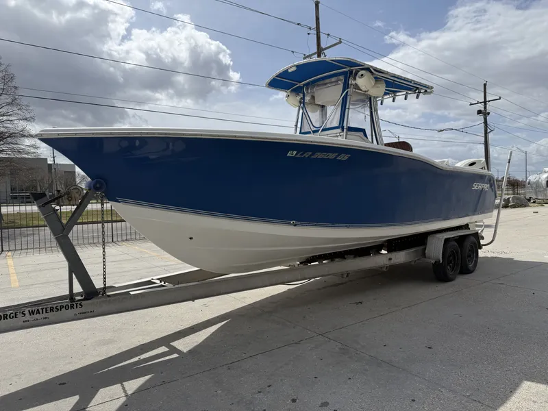 Slide: The Image of 2007 Sea Pro 270 CC boat on trailer, blue hull. - 3