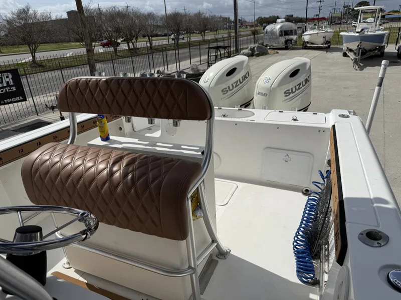 Slide: The Image of Interior view of a 2007 Sea Pro 270 CC boat with Suzuki engines. - 7