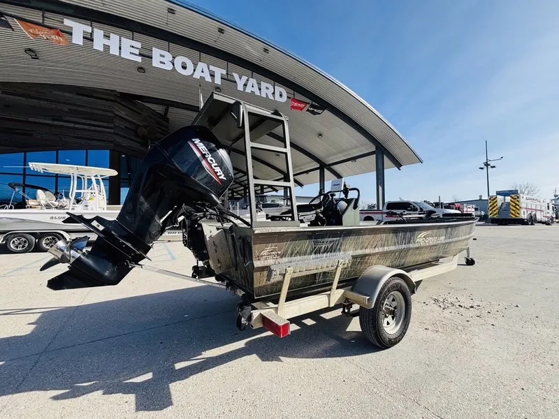 Slide: The Image of 2010 Prodrive 1864 boat outside a boat dealership. - 3