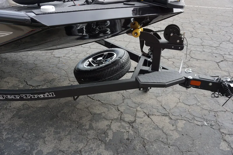 Slide: The Image of Ranger RT188P 2026 boat trailer with spare tire on asphalt. - 11