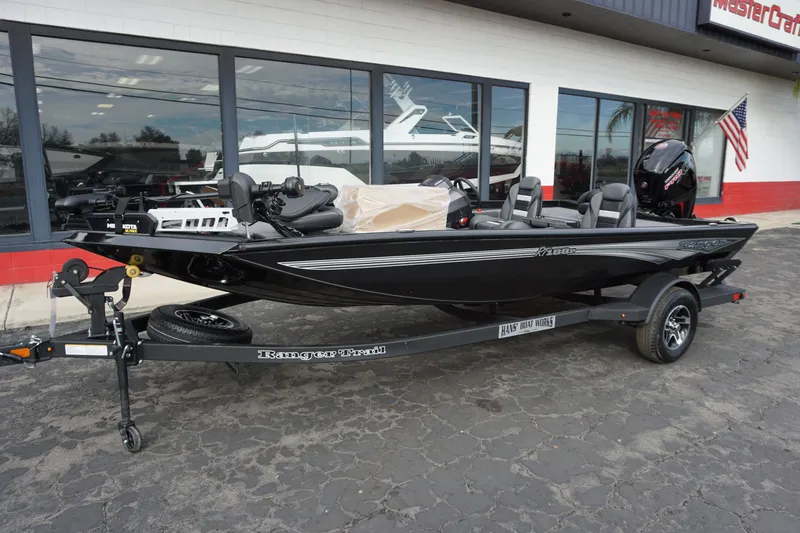 Slide: The Image of 2026 Ranger RT188P boat on trailer outside a store. - 12