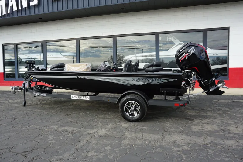Slide: The Image of 2026 Ranger RT188P boat parked in front of a store. - 3