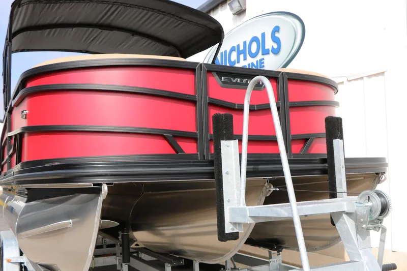 Slide: The Image of 2026 Evotti 521CS pontoon boat in vibrant red on a trailer at Nichols Marine. - 4