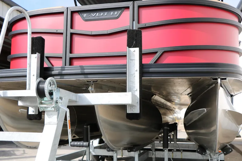 Slide: The Image of Red Evotti 521CS pontoon boat on trailer, 2026 model, close-up view. - 5