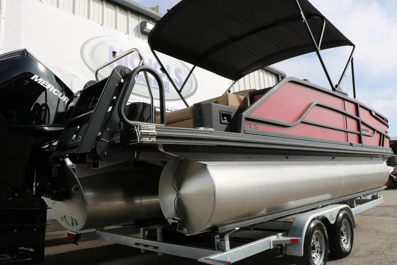 Slide: The Image of 2026 Evotti 521CS pontoon boat on trailer, featuring sleek design and Mercury engine. - 7
