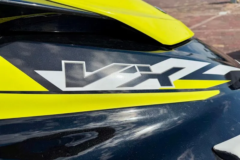 Slide: The Image of Close-up of 2019 Yamaha WaveRunner VX Deluxe logo with vibrant yellow accents. - 10