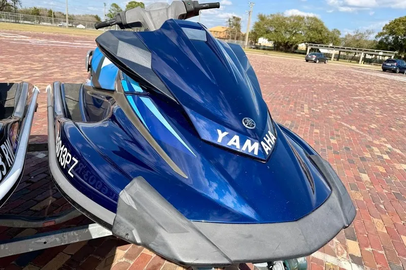 Slide: The Image of 2019 Yamaha WaveRunner VX Deluxe in blue, parked on a brick surface. - 17