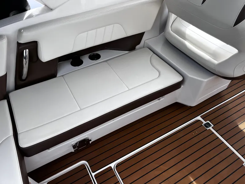 Slide: The Image of Interior of 2017 Chaparral 337 SSX with white seating and wood flooring. - 16
