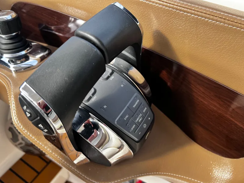 Slide: The Image of Control console of a 2017 Chaparral 337 SSX boat. - 44