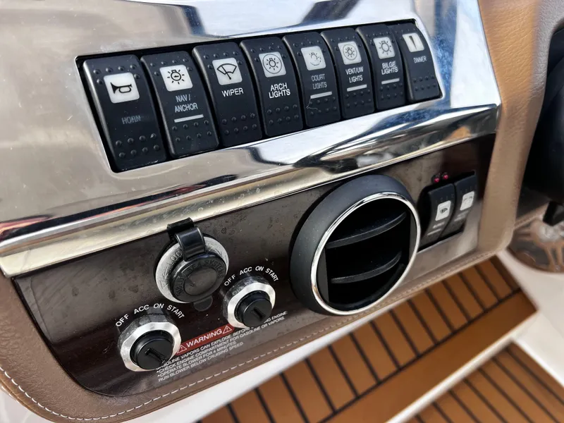 Slide: The Image of Dashboard of a 2017 Chaparral 337 SSX boat with switches. - 46
