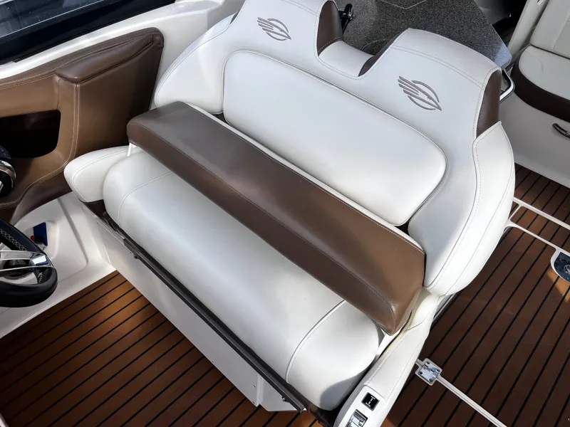 Slide: The Image of Interior of 2017 Chaparral 337 SSX with brown and white leather seats. - 49