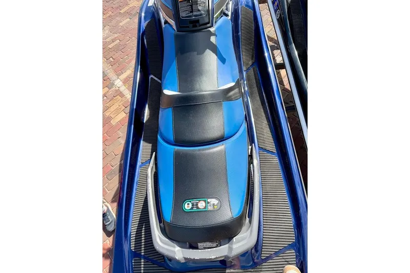 Slide: The Image of 2015 Yamaha WaveRunner VX Cruiser, blue and black seat, parked on brick pavement. - 22