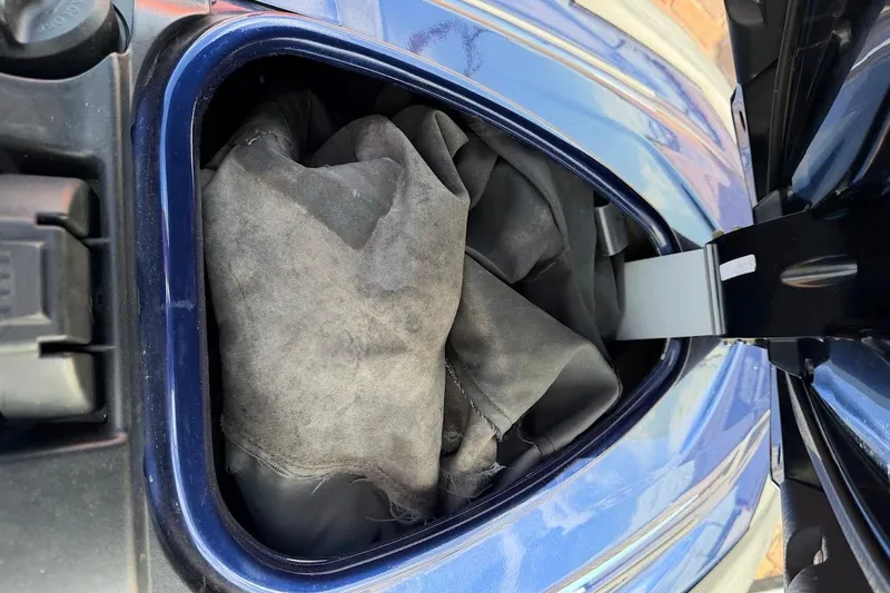 Slide: The Image of Open storage compartment of a 2015 Yamaha WaveRunner VX Cruiser with fabric inside. - 27