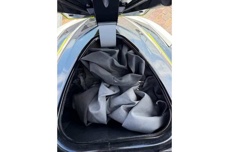 Slide: The Image of Open storage compartment of 2015 Yamaha WaveRunner VX Cruiser with fabric inside. - 28