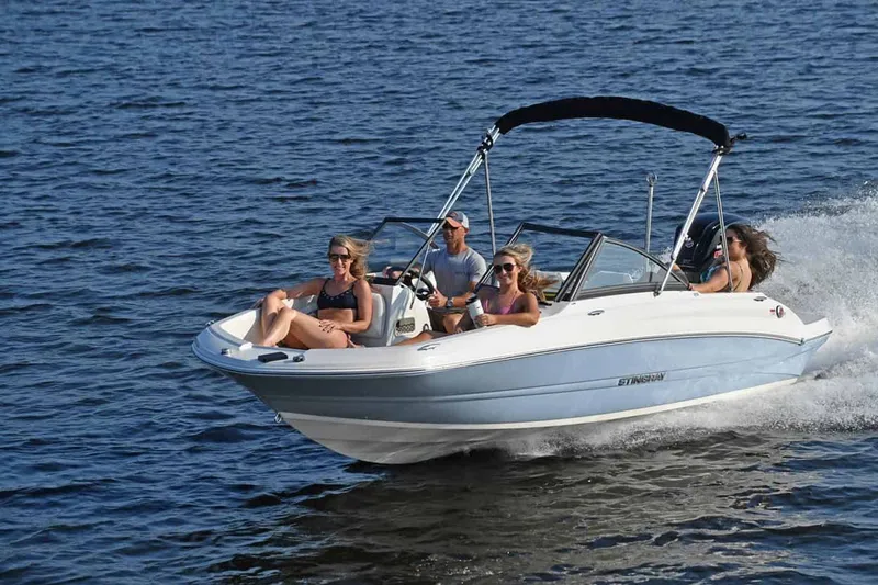 Slide: The Image of Stingray 191 DC 2025 boat on water with passengers. - 13