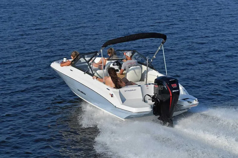 Slide: The Image of Stingray 191 DC 2025 boat on open water with passengers. - 14
