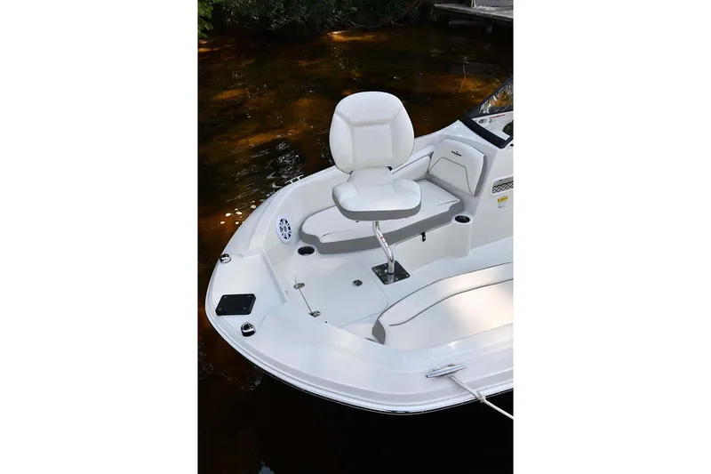 Slide: The Image of 2025 Stingray 191 DC boat with white seat on calm water. - 8