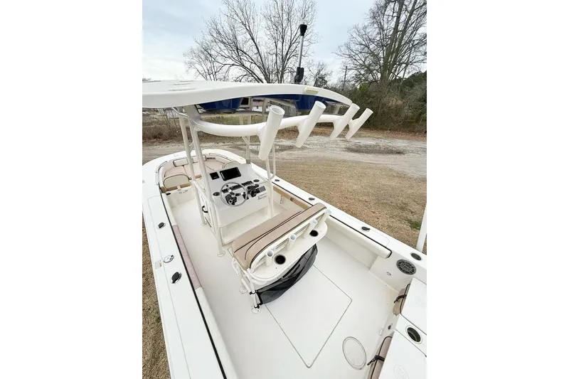 Slide: The Image of 2024 Carolina Skiff 24 Ultra Elite boat interior with steering console and seating. - 17
