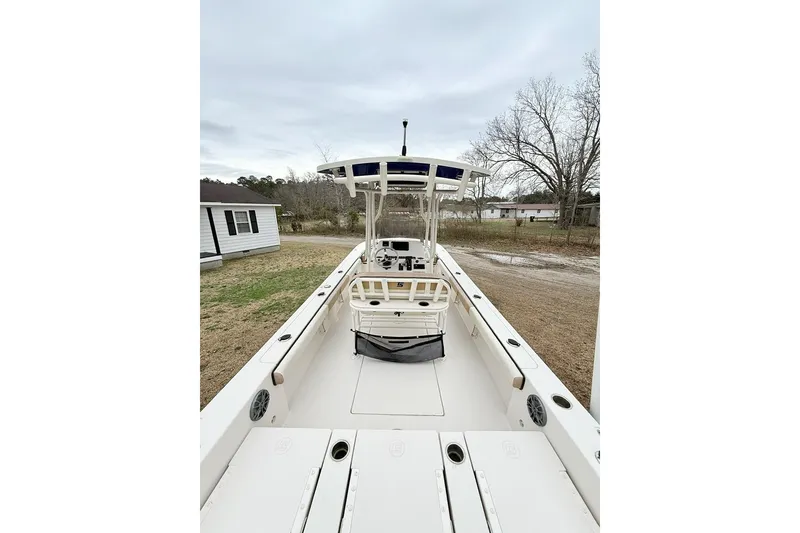 Slide: The Image of 2024 Carolina Skiff 24 Ultra Elite boat, spacious deck, outdoor setting. - 18