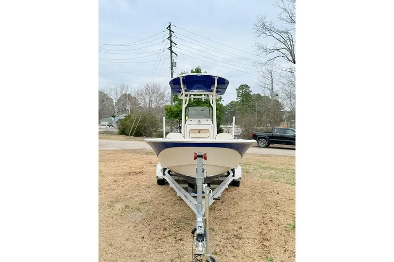 Slide: The Image of 2024 Carolina Skiff 24 Ultra Elite boat on trailer, parked outdoors. - 5