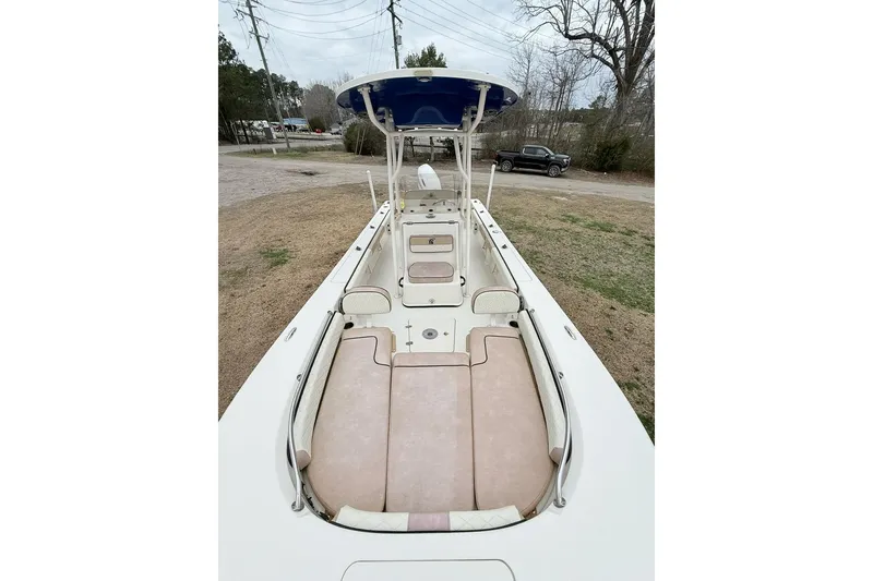 Slide: The Image of 2024 Carolina Skiff 24 Ultra Elite boat with spacious seating and T-top canopy. - 6