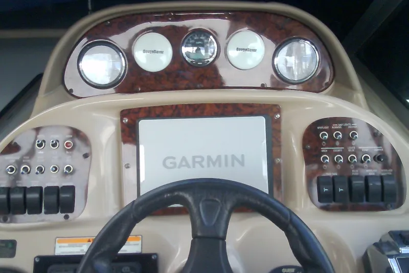 Slide: The Image of Dashboard of 2005 Sea Ray 300 Sundancer with Garmin navigation system. - 18