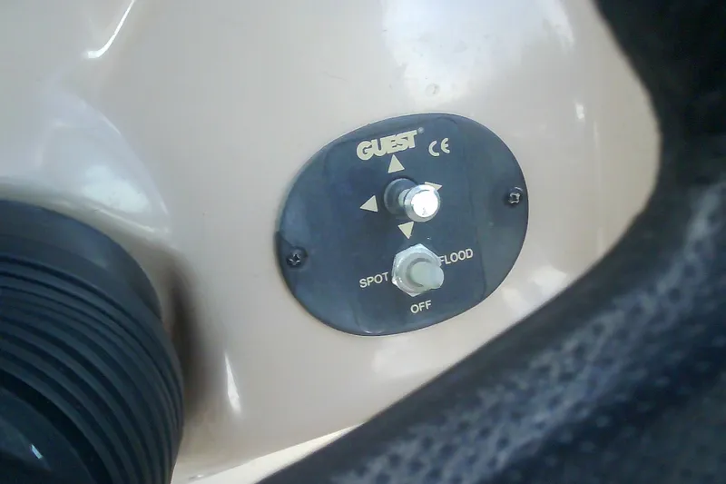 Slide: The Image of Control panel for spotlight and floodlight on 2005 Sea Ray 300 Sundancer boat. - 22