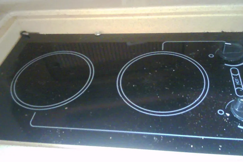 Slide: The Image of Built-in stovetop on 2005 Sea Ray 300 Sundancer yacht kitchen. - 30