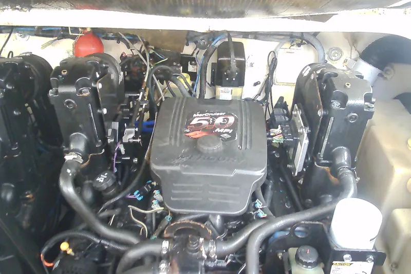 Slide: The Image of Engine compartment of a 2005 Sea Ray 300 Sundancer boat, featuring a MerCruiser 5.0 MPI engine. - 40