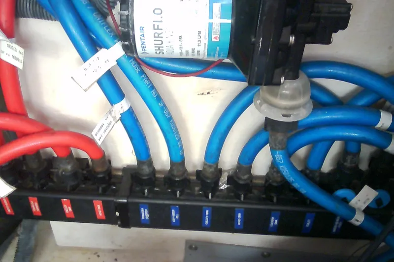 Slide: The Image of Electrical wiring and water pump system in a 2005 Sea Ray 300 Sundancer boat. - 41