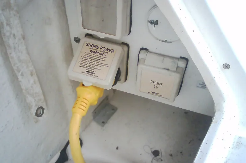 Slide: The Image of Shore power connection on 2005 Sea Ray 300 Sundancer boat with yellow cable. - 47