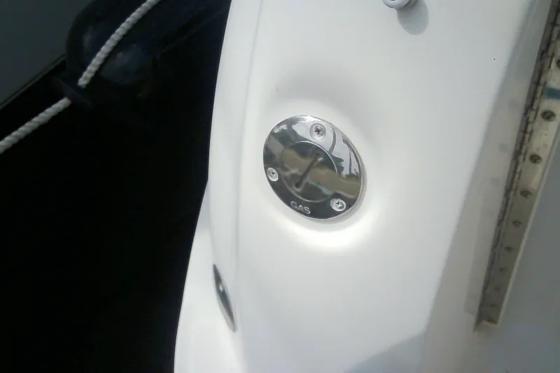 Slide: The Image of Gas cap on 2005 Sea Ray 300 Sundancer boat, close-up view. - 49