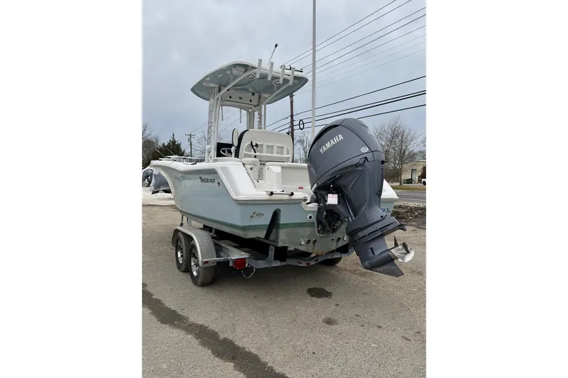 Slide: The Image of 2023 Tidewater 220 LXF boat with Yamaha outboard motor on trailer. - 10