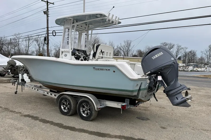 Slide: The Image of 2023 Tidewater 220 LXF boat on trailer with Yamaha outboard motor. - 9
