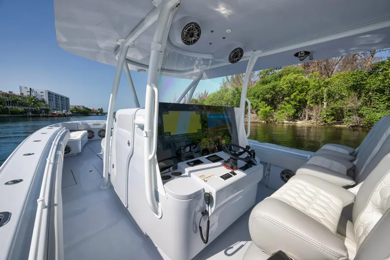 Slide: The Image of 2025 Contender 44 ST boat interior with modern helm and seating. - 15