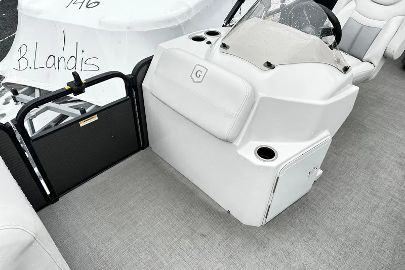Slide: The Image of 2018 Godfrey Sweetwater 2486 C boat interior with helm and seating area. - 5